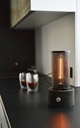 black_wood_lamp_coffee_table_warm_light.jpg